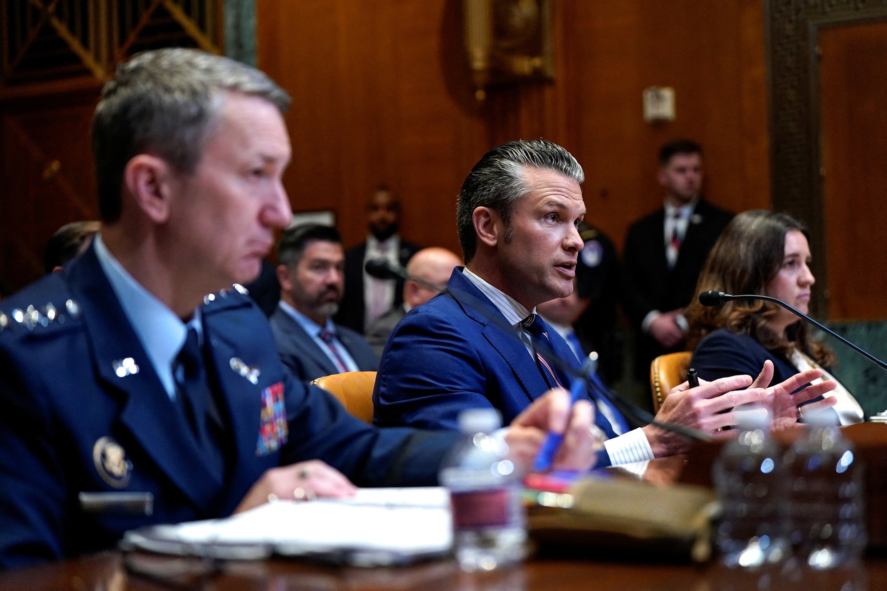 PHOTO: Defense Secretary Pete Hegseth, Joint Chiefs of Staff Chairman Air Force General John Caine and  Special Assistant to the Secretary of Defense Bryn Woollacott MacDonnell attend a Senate Appropriations Committee hearing in Washington, June 11, 2025.