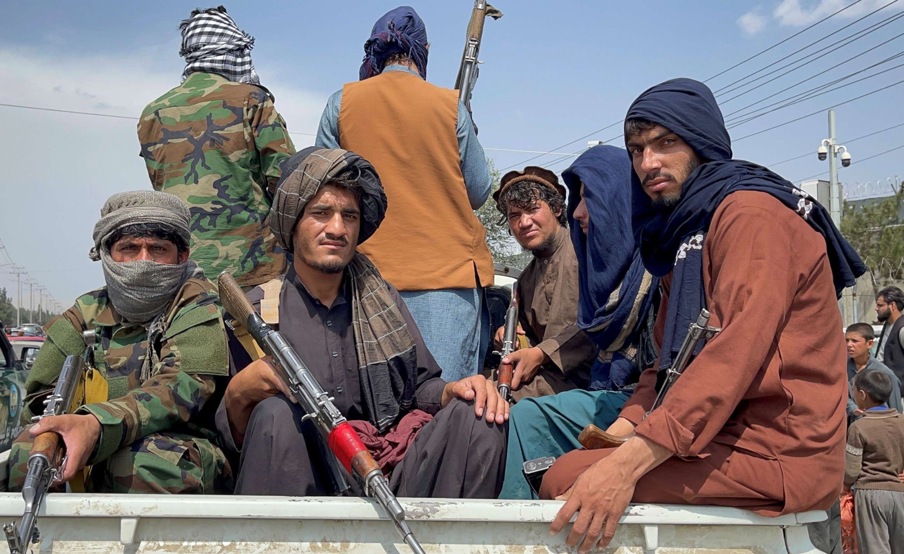 PHOTO: In this Aug. 31, 2021, file photo, Taliban forces patrol near the entrance gate of Hamid Karzai International Airport, a day after U.S troops withdrawal, in Kabul, Afghanistan.