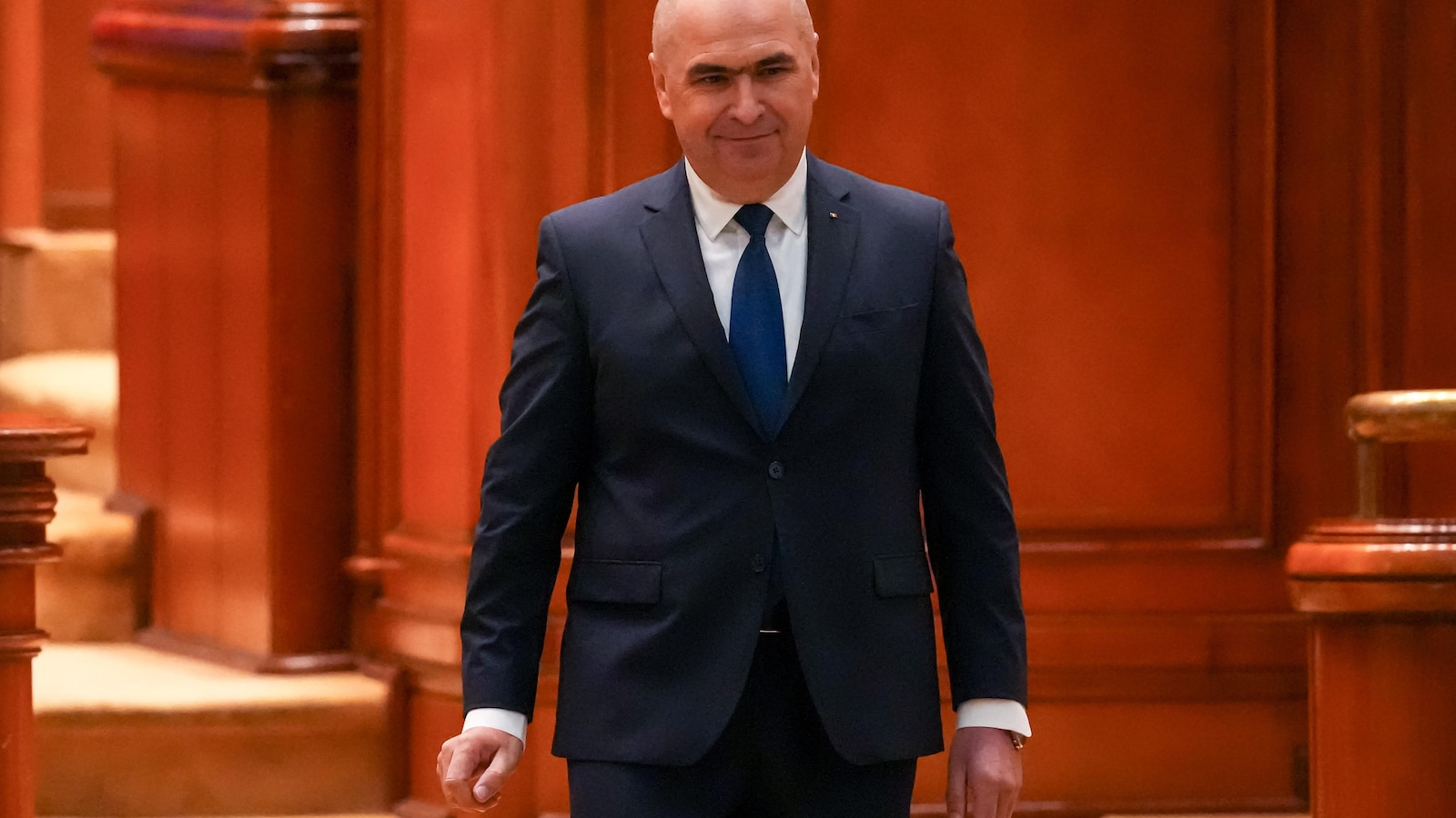 Romanian PM fights for survival as no-confidence motion is debated in Parliament