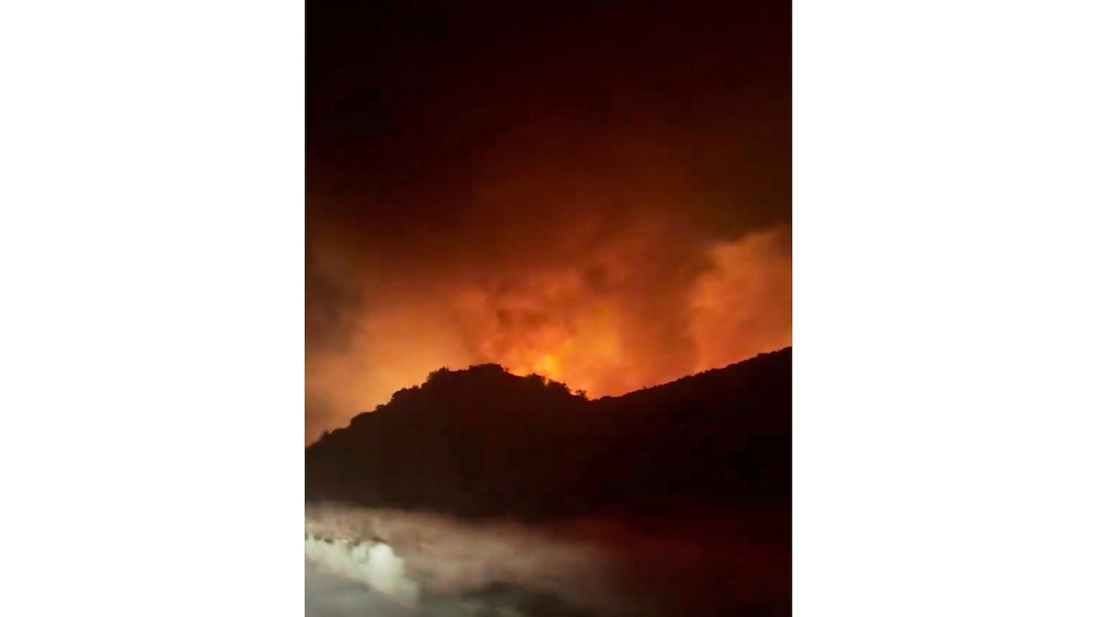 Firefighters make progress against fast-moving blaze along highway north of Los Angeles