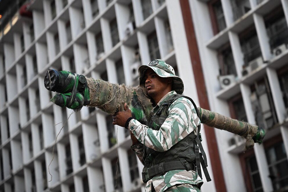 PHOTO: A member of the Bolivarian National Militia holds a Russian-made surface-to-air missile launcher as he takes part in a rally against US military activity in the Caribbean, in Caracas on Oct. 30, 2025.