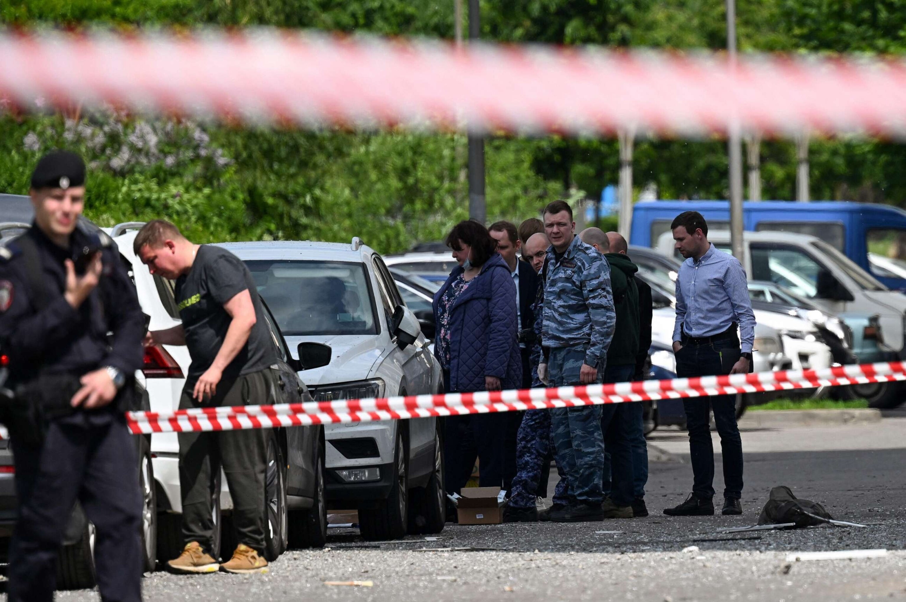 PHOTO: Law enforcement officers and investigators are seen outside a damaged multi-story apartment building after a reported drone attack in Moscow, May 30, 2023.