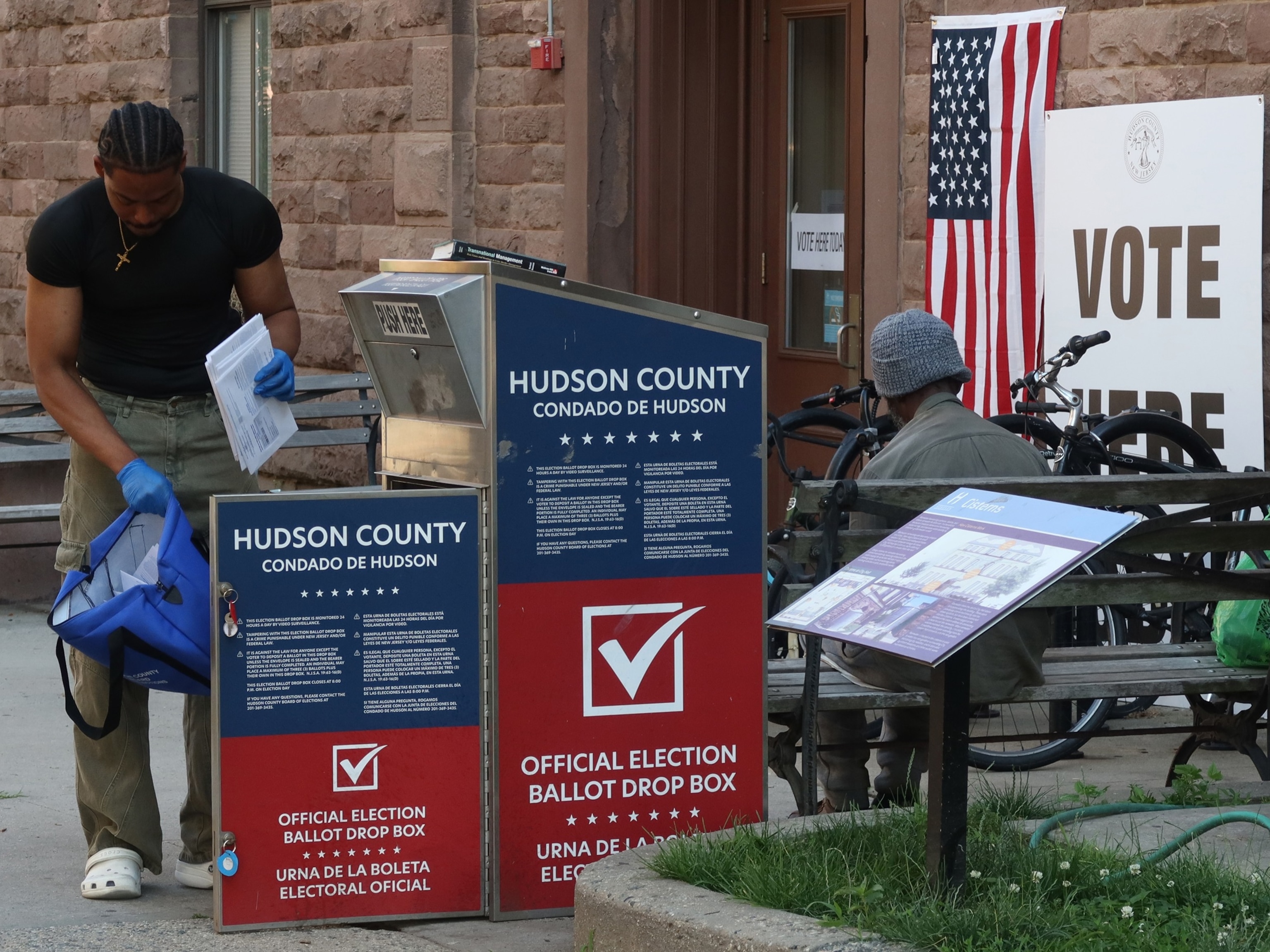 PHOTO: A  poll worker collects mail in ballots from a drop box for the New Jersey primary election, June 4, 2024, in Hoboken, New Jersey.  