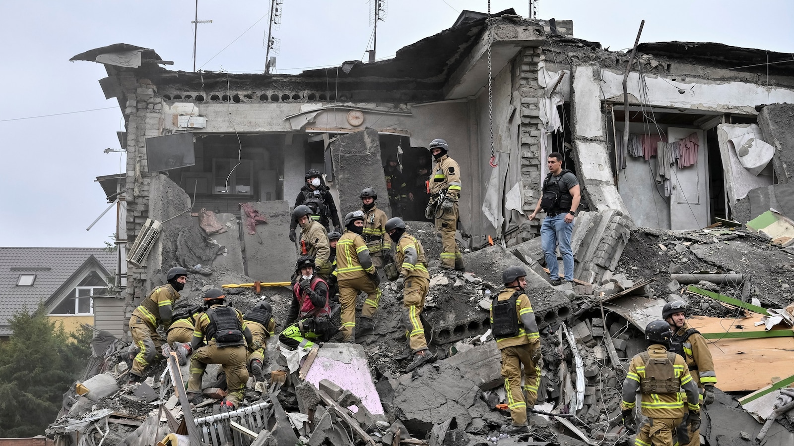 At least 20 people, including three children, were killed in a Russian strike that flattened an apartment building in Zaporizhzhia, Ukraine, on Saturday, according to local officials.