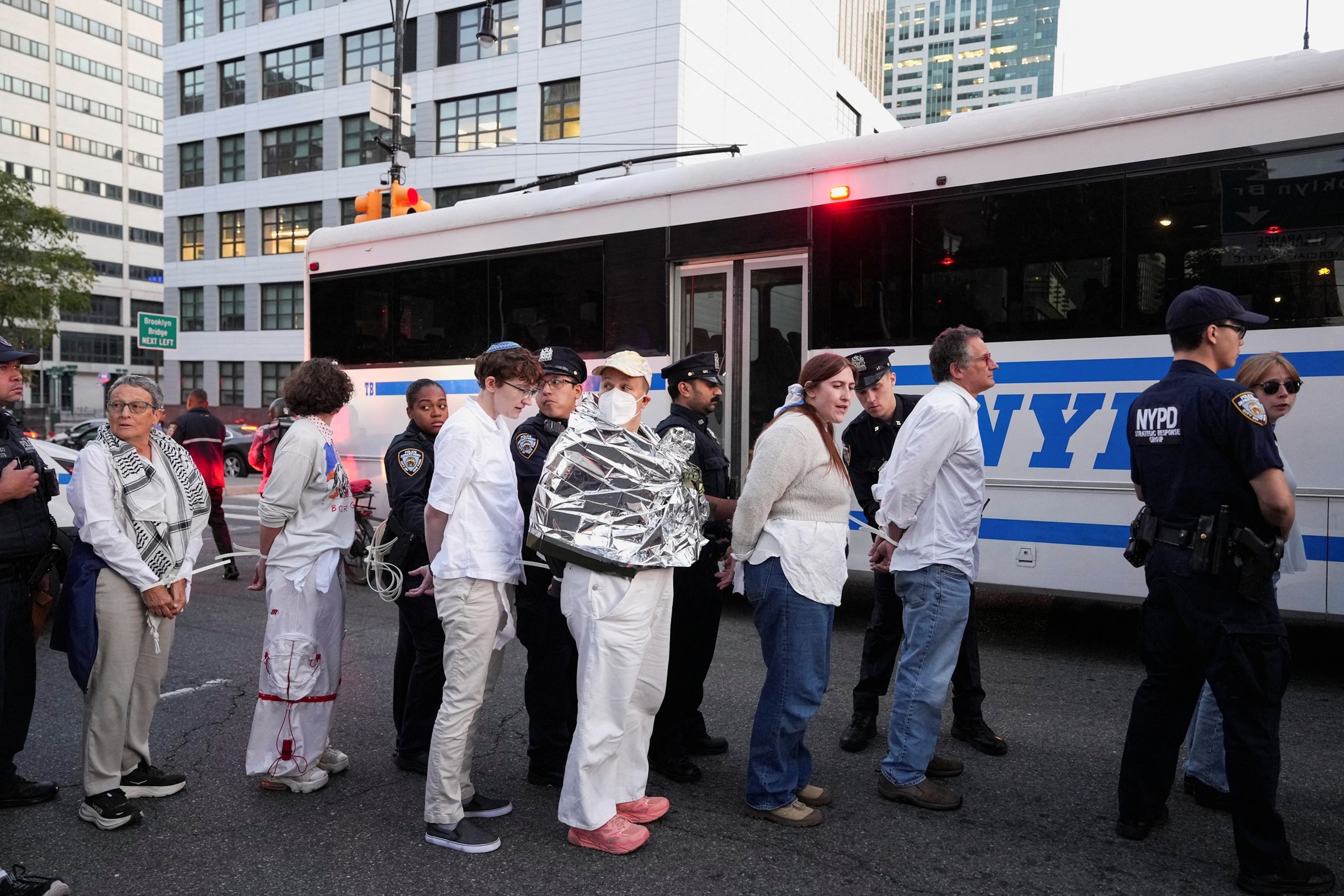 PHOTO: NYPD officers detain people after they blocked the Brooklyn side of the Brooklyn Bridge to protest against Israel's military action in Gaza, in New York, Oct. 2, 2025.