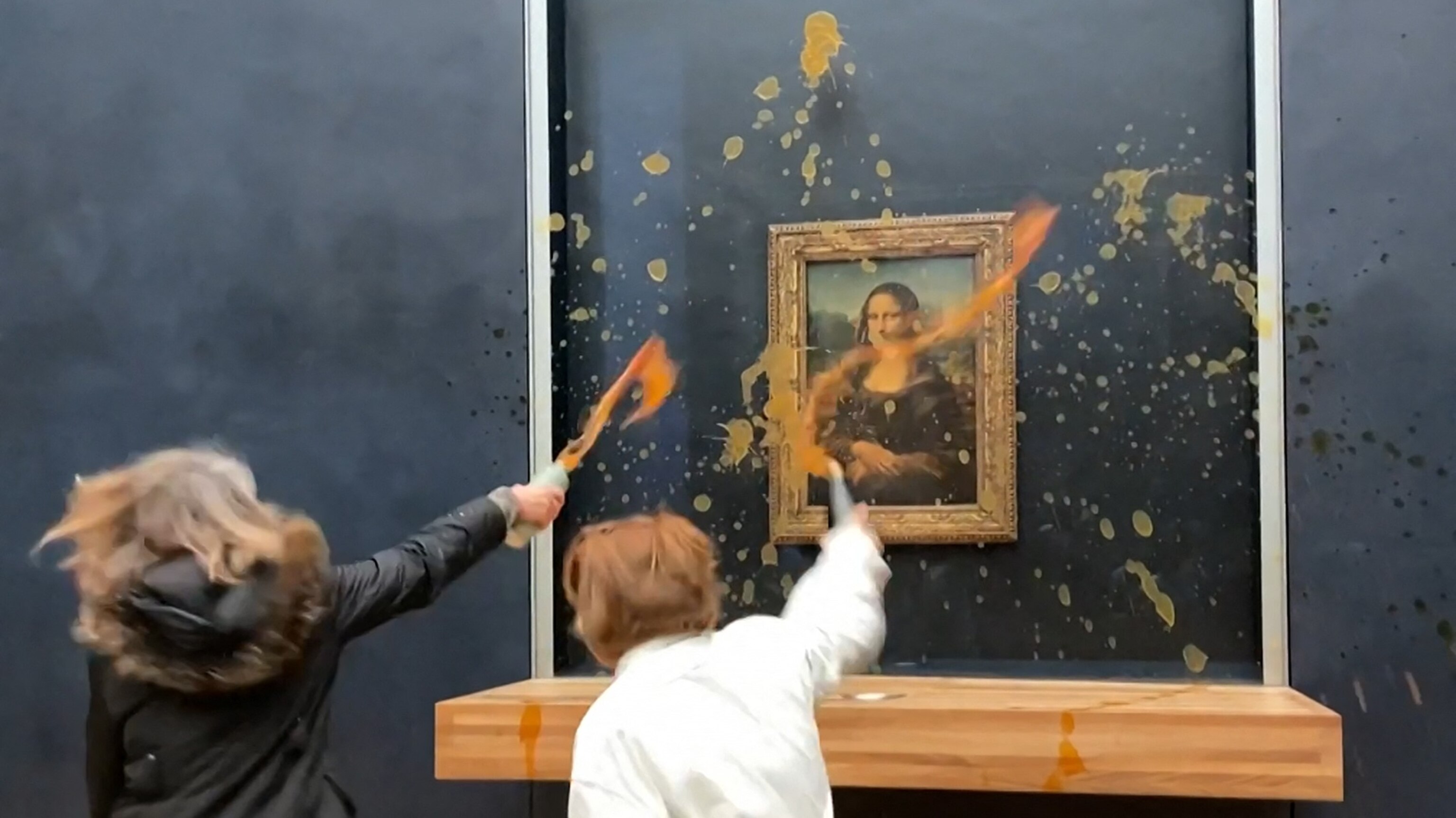 Activists splatter 'Mona Lisa' with soup in Louvre Museum in Paris