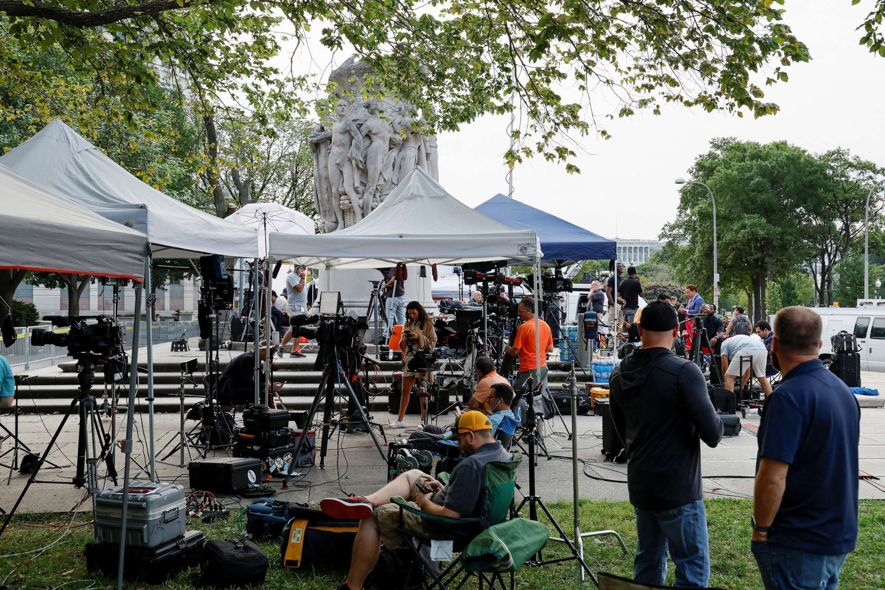 PHOTO: Media members prepare for the arrival of former President Donald Trump, who is facing federal charges in connection with attempts to overturn his 2020 election defeat, at U.S. District Court in Washington, D.C., Aug. 3, 2023.