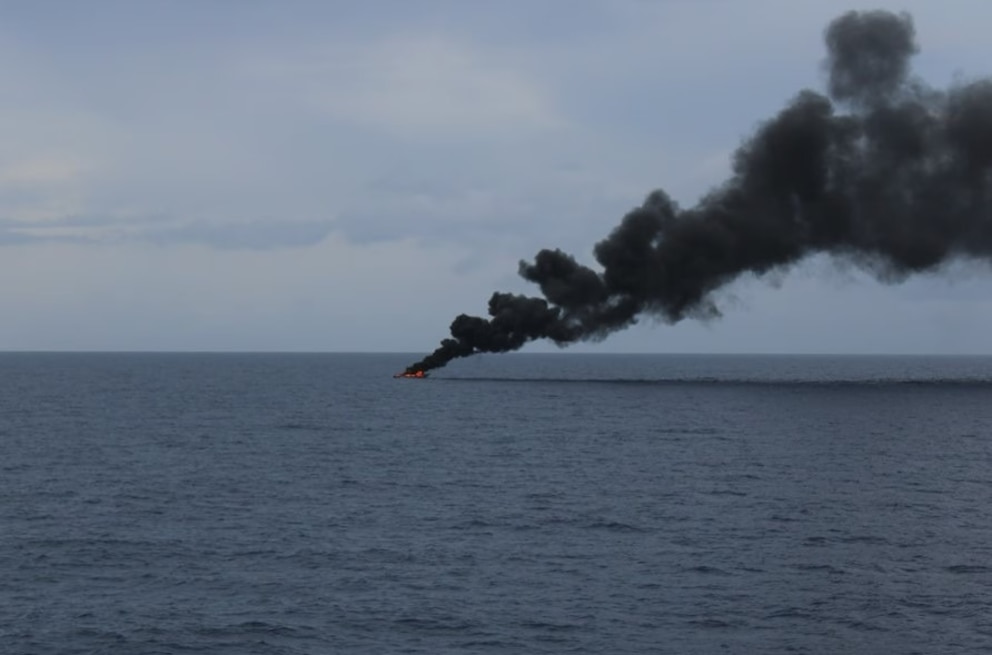 PHOTO: A go-fast vessel burns the day after the crew of Coast Guard Cutter Diligence (WMEC 616) interdicted the suspected drug smuggling vessel in the Caribbean Sea, Sept. 7, 2025.
