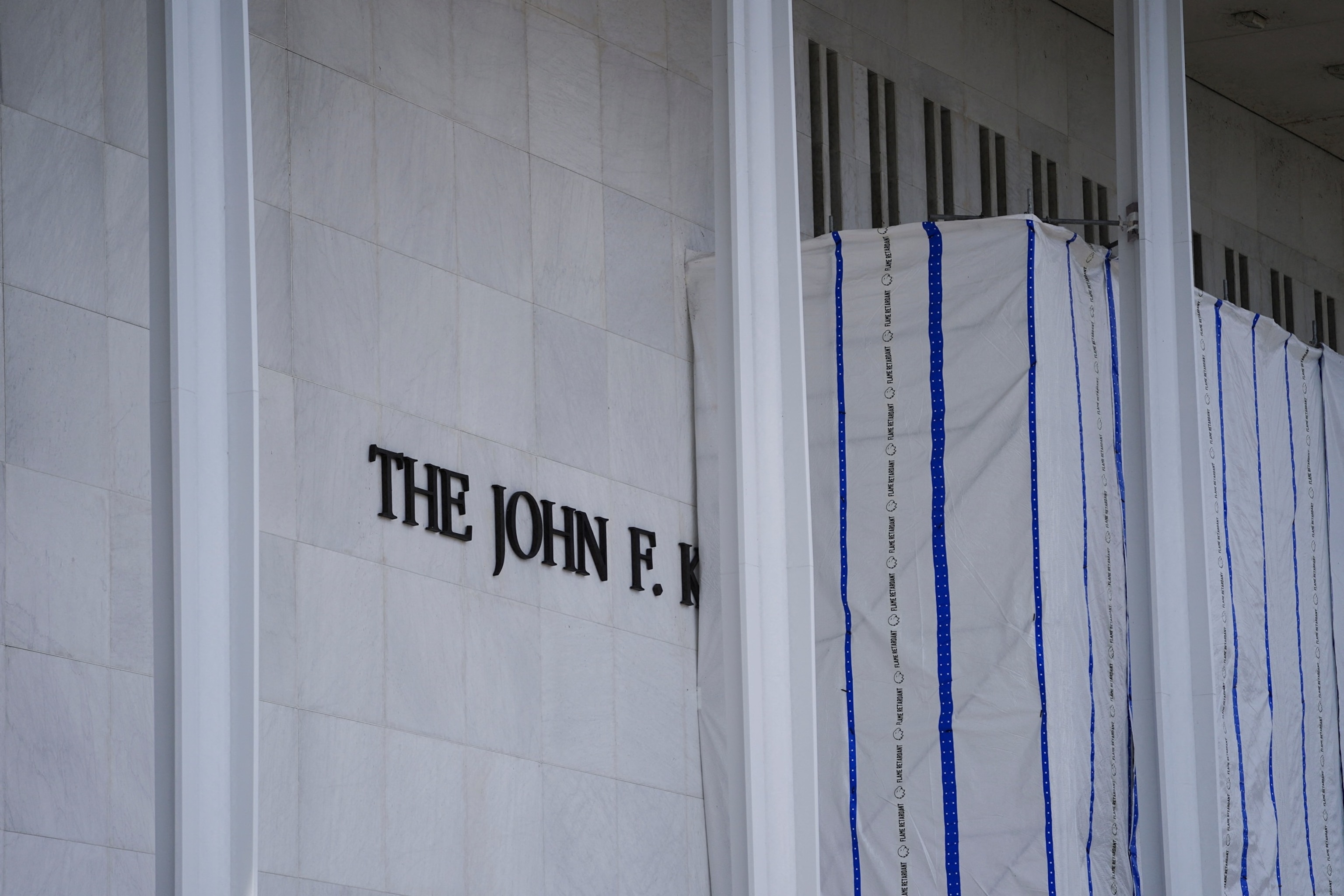 PHOTO: Tarp remains surrounding scaffolding after the removal of letters from the facade of the John F. Kennedy Memorial Center for the Performing Arts in Washington, D.C., Sept. 2, 2026.