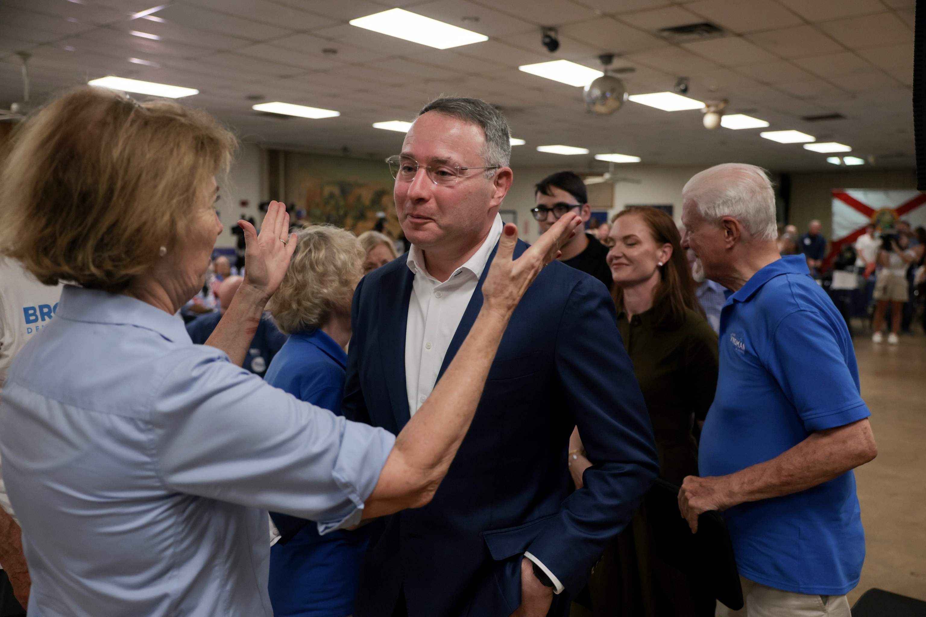 PHOTO: Florida Democratic Senate candidate, retired Army Lt. Col. Alex Vindman, receives well-wishes from supporters at an election-night watch party after losing to Angie Nixon, at an election-night watch party, August 18, 2026, in Oakland Park, Fla.