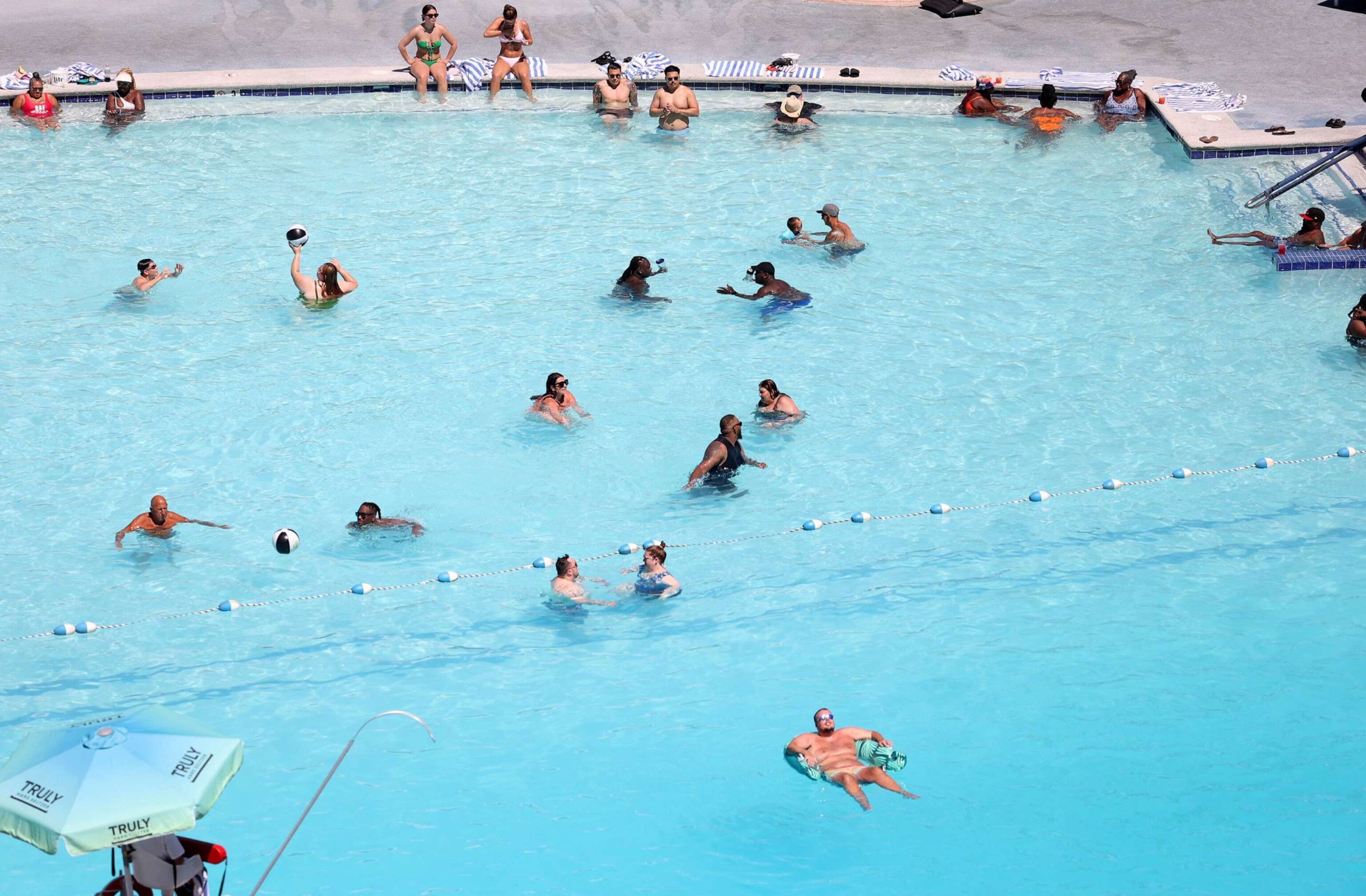 PHOTO: People relax in the Horseshoe Las Vegas pool during a heat wave in Las Vegas, Nevada, on July 14, 2023.