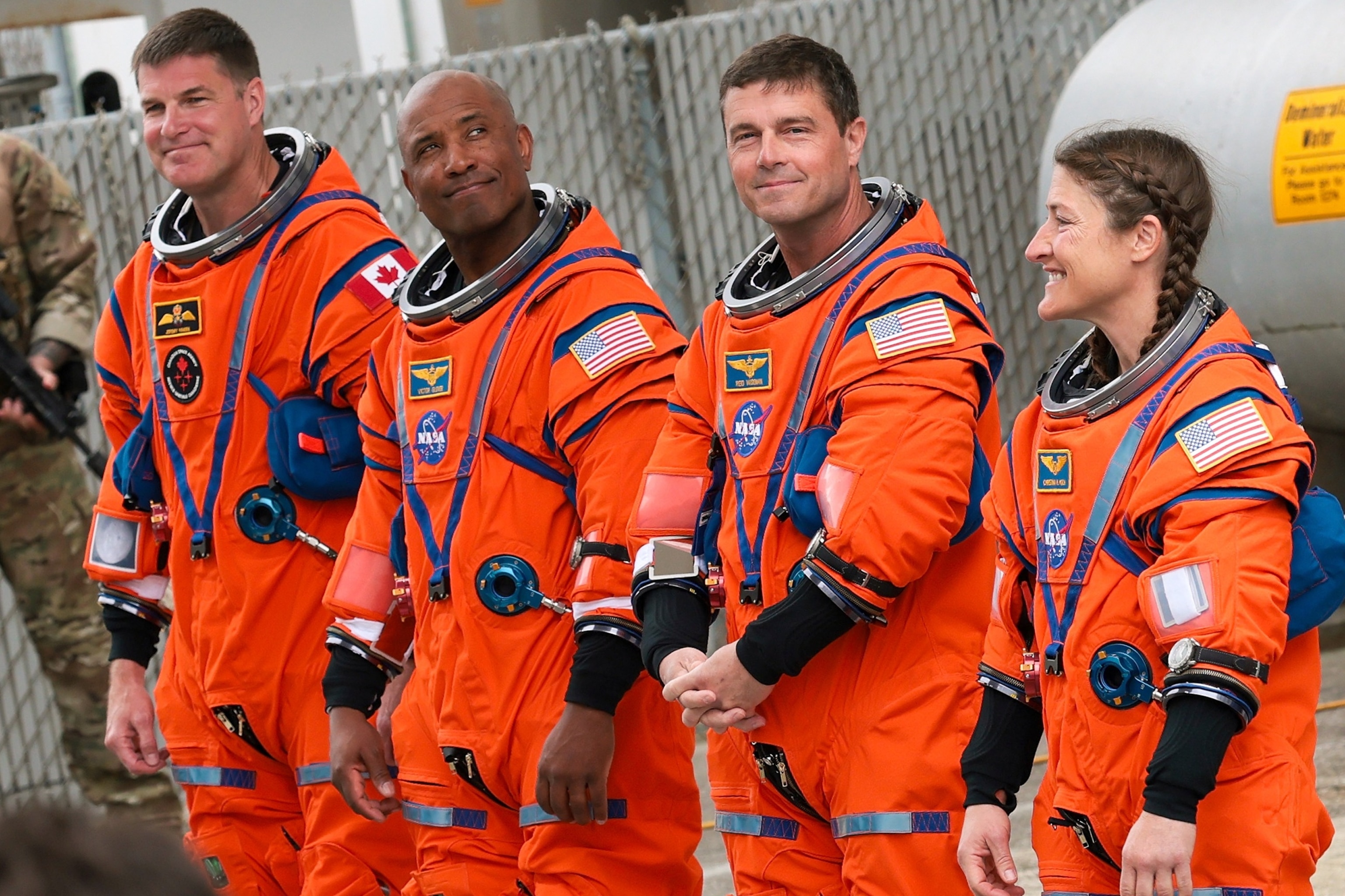PHOTO: CSA astronaut Jeremy Hansen with NASA astronauts Victor Glover, Reid Wiseman and Christina Koch walk out before traveling to the launch pad to board the Artemis II crewed lunar mission at Kennedy Space Center in Florida, April 1, 2026.