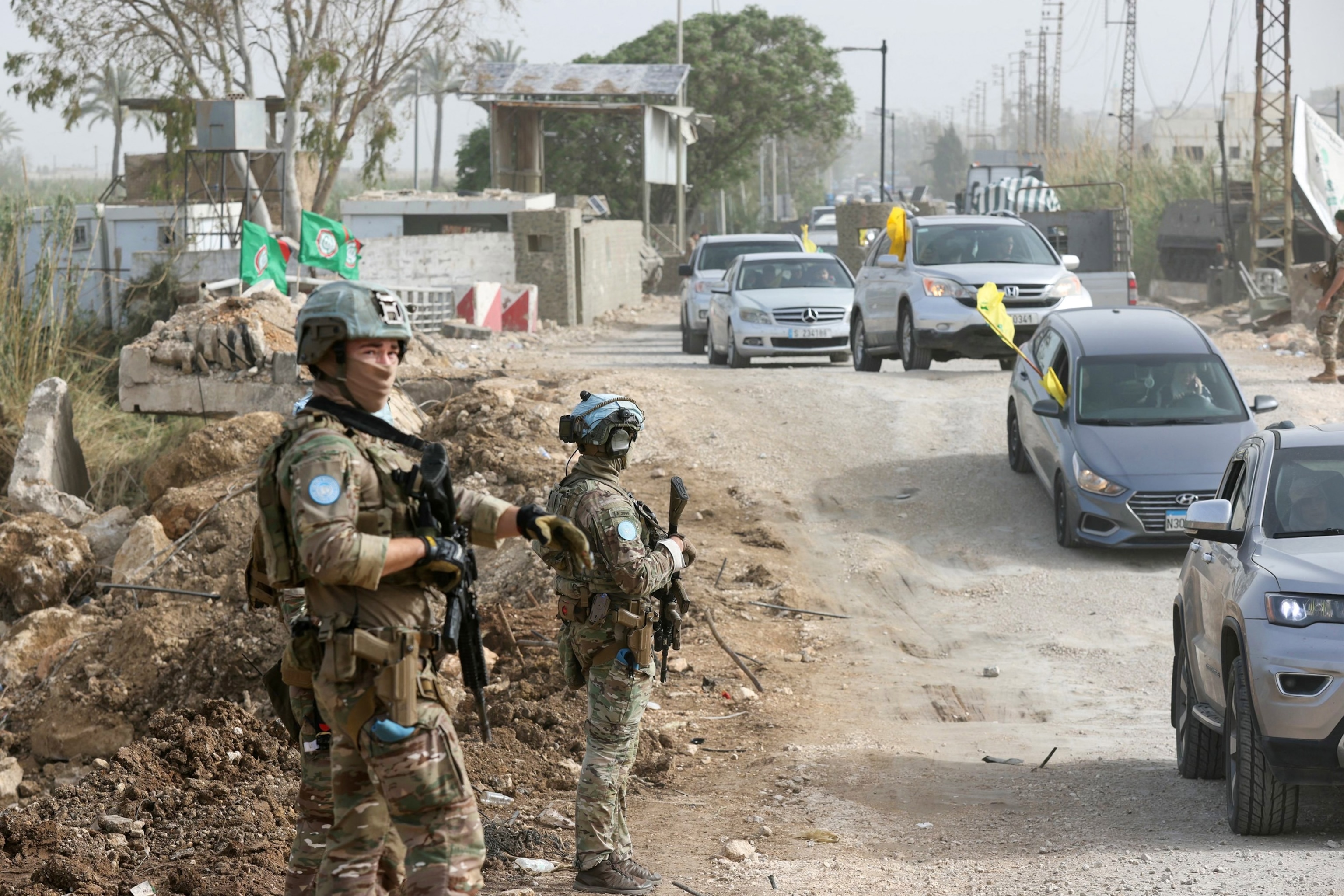 PHOTO: A French contingent of the United Nations Interim Force in Lebanon (UNIFIL) patrols the area as displaced residents waving Hezbollah flags make their way back to their homes in the southern Lebanese area of Al-Qasmiyeh on April 18, 2026. 