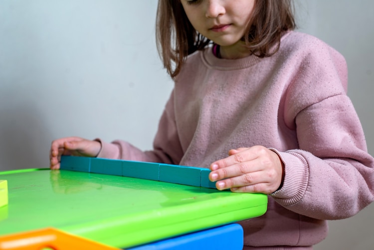 Child with building blocks