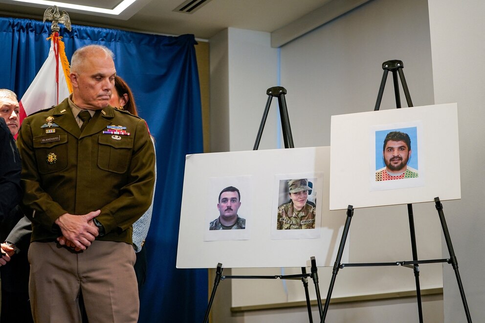 PHOTO: Brigadier General Leland D. Blanchard II looks towards pictures of two National Guard members who were shot along with a picture of a suspect, Afghan national Rahmanullah Lakanwal, at a press conference in Washington, D.C., Nov. 27, 2025. 