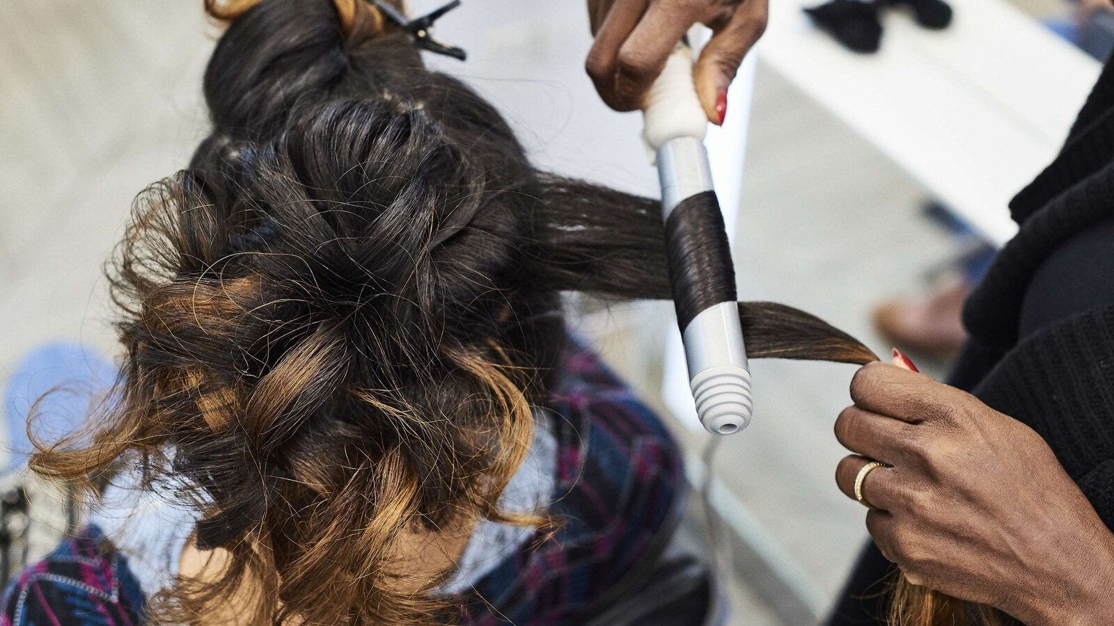 An employee styles a customer's hair at an Ulta Beauty Inc. store in New York, on May 31, 2018.