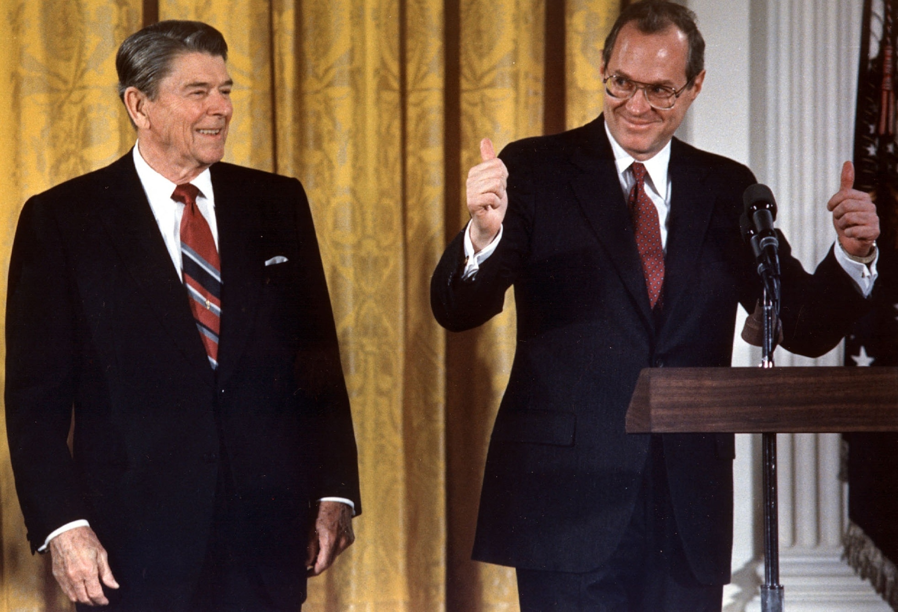 PHOTO: In this Feb. 18, 1988, file photo, Supreme Court Justice Anthony Kennedy gives a thumbs-up gesture to those who gathered to watch him be sworn in for the second time, in the White House East Room in Washington, DC. 