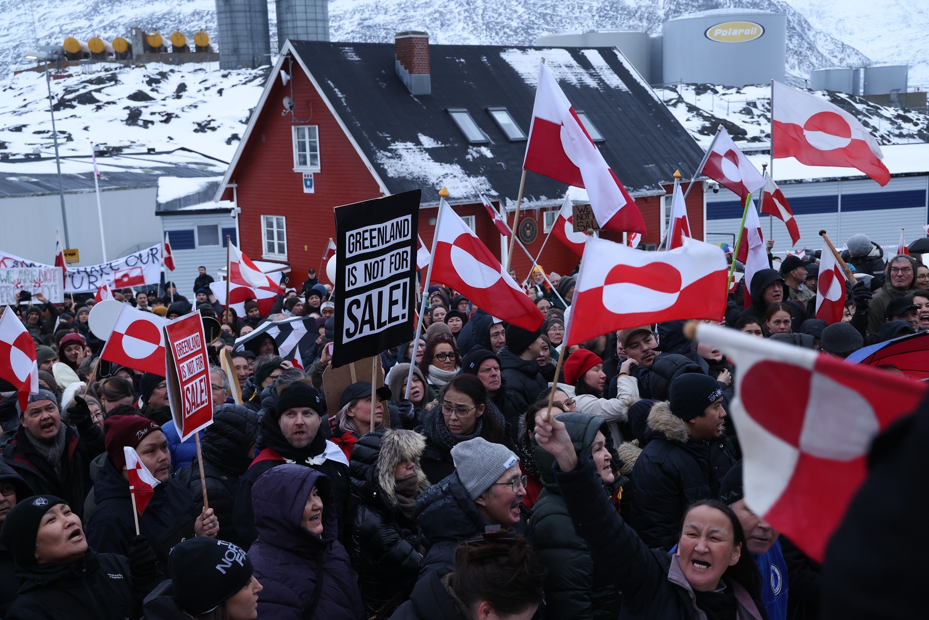 PHOTO: In this Jan. 17, 2026, file photo, people bear Greenlandic flags as they gather in front of the U.S. consulate  protest against U.S. President Donald Trump and his announced intent to acquire Greenland, in Nuuk, Greenland. 
