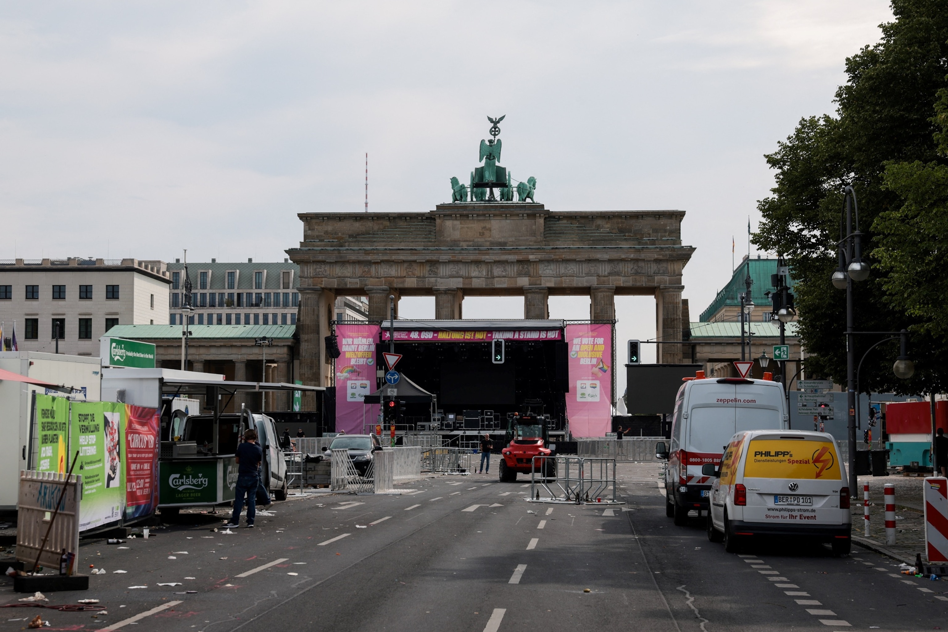 PHOTO: A person looks on as parade infrastructure is dismantled near the Brandenburg Gate in Berlin, Germany, July 26, 2026.