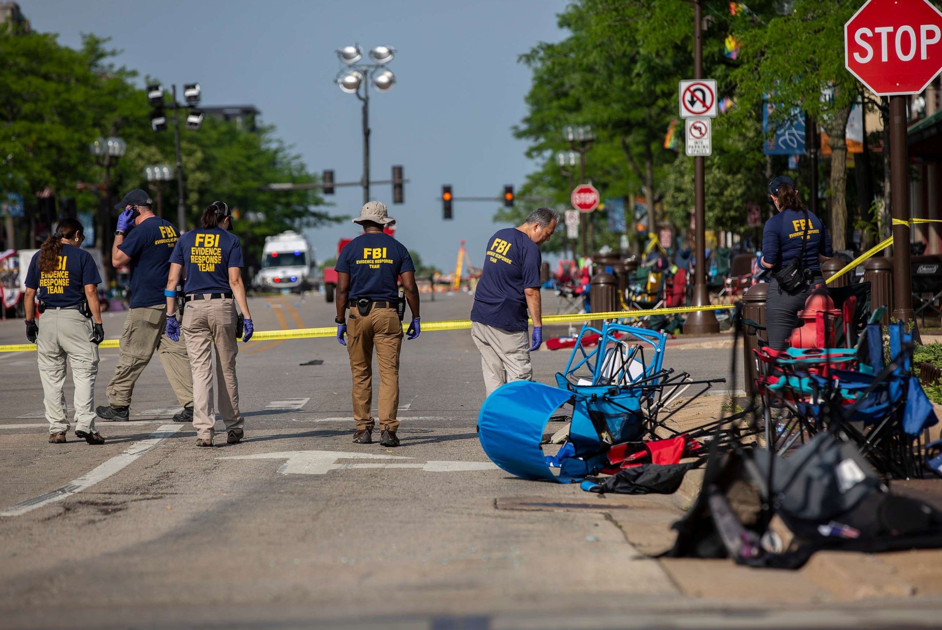 PHOTO: In this July 5, 2022, file photo, FBI agents work the scene of a shooting at a Fourth of July parade in Highland Park, Illinois.