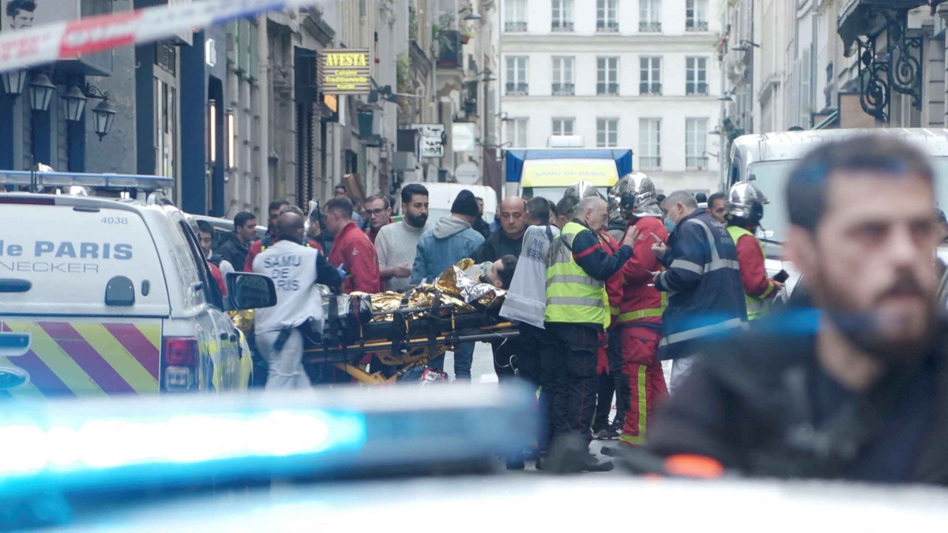 PHOTO: First responders move a man on a gurney after gunshots were fired in central Paris, Dec. 23, 2022, in this still image obtained form a social media video.