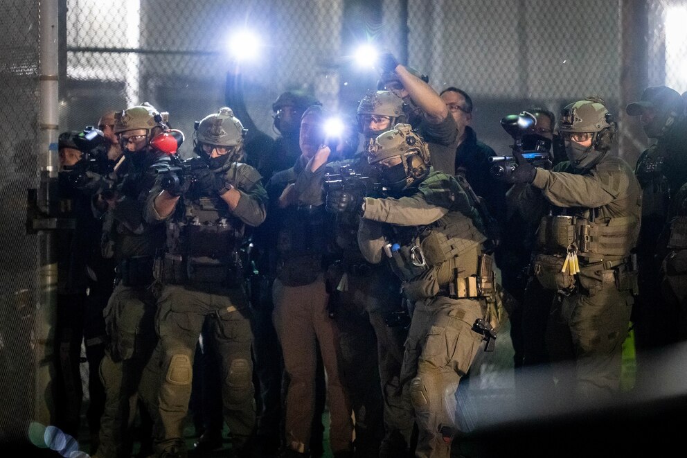 PHOTO: Federal agents fire less lethal munitions towards protesters outside Delaney Hall which is being used as an Immigration and Customs Enforcement detention center on May 29, 2026, in Newark, New Jersey.