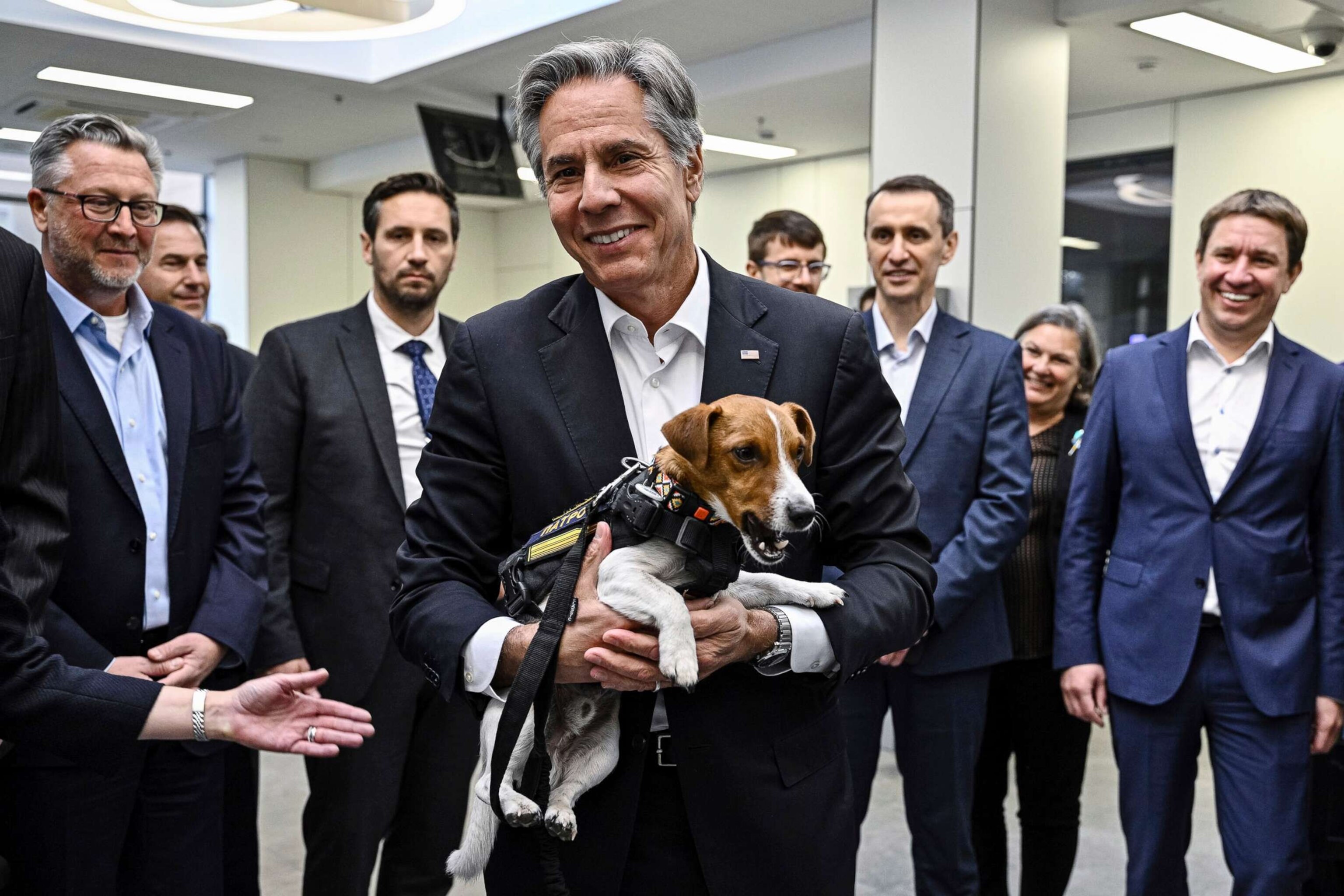 PHOTO: Secretary of State Antony Blinken, center,  holds a landmine sniffer dog, during his visits to a children hospital in Kyiv, Ukraine, Sept. 8, 2022. 