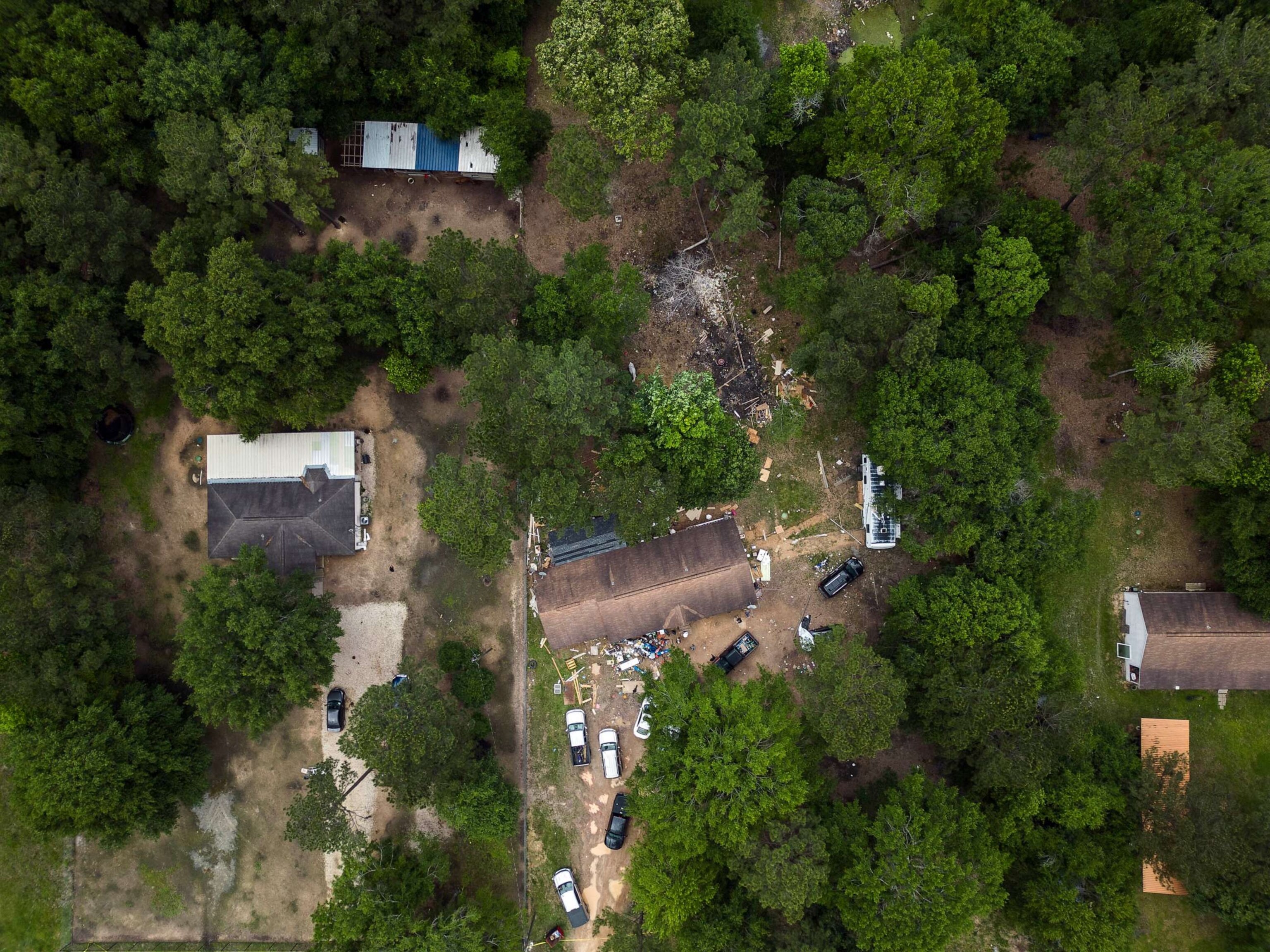 PHOTO: In this aerial view, an exterior of a crime scene where five people were killed after a shooting inside a home, April 29, 2023 in Cleveland, Texas.