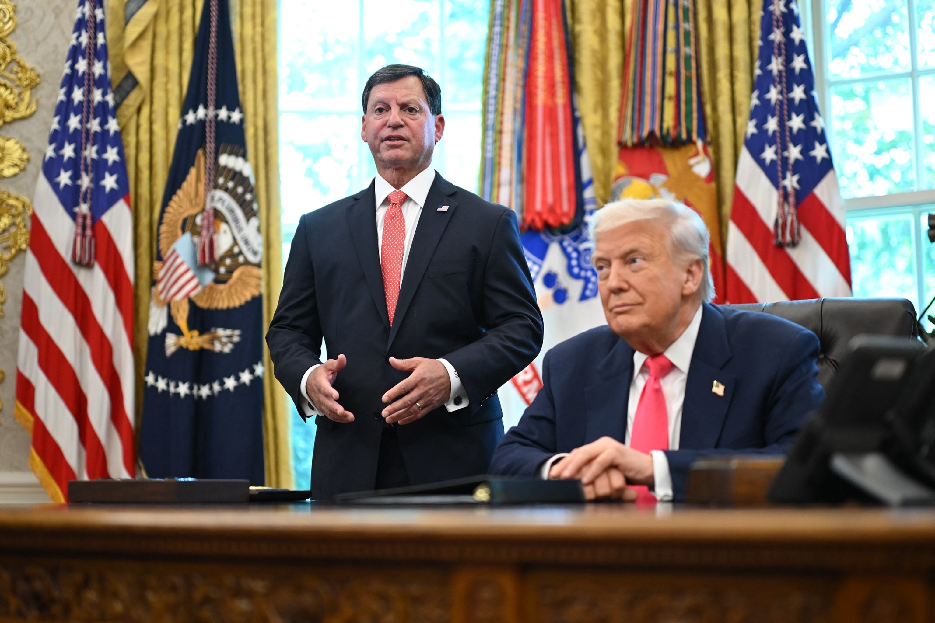 PHOTO: Commissioner of the Social Security Administration Frank Bisignano speaks as President Donald Trump listens in the Oval Office of the White House in Washington, August 14, 2025.