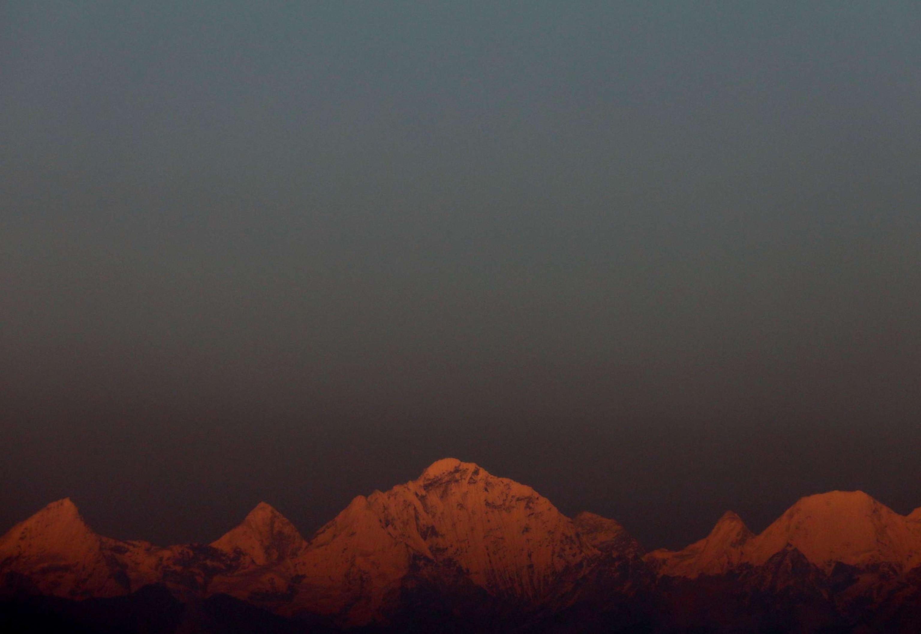 FILE PHOTO: In this file photo, Mount Everest, the world's highest peak, and other peaks of the Himalayan range are seen during the sunset on a clear day from Kathmandu, Nepal, on October 17, 2022.