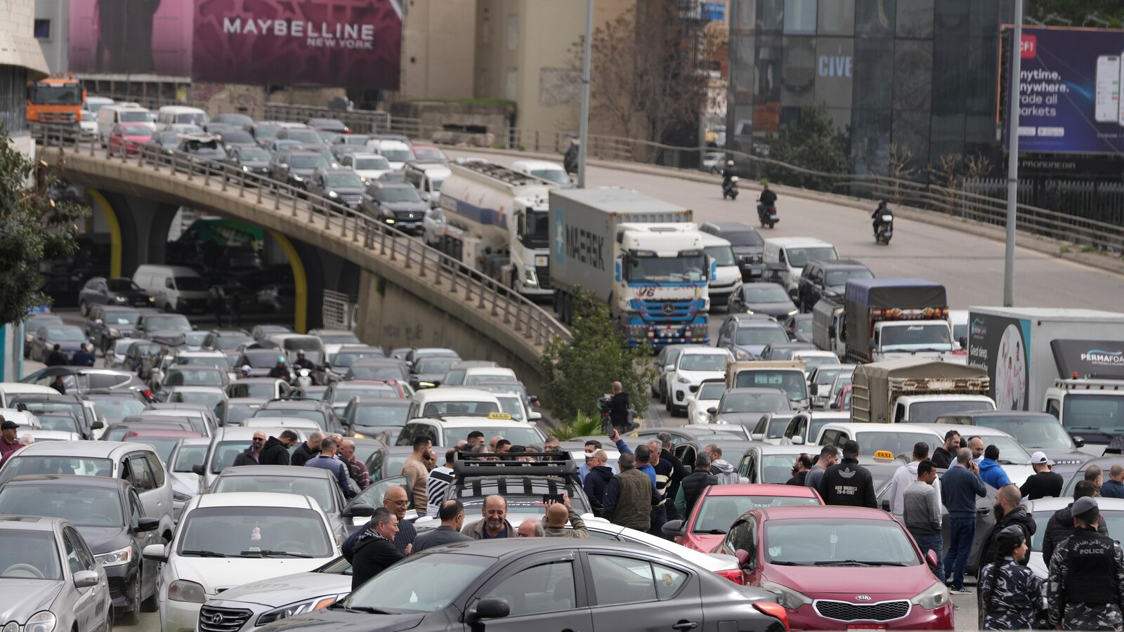 Protesters block Beirut roads after Cabinet approves new taxes that raise fuel prices