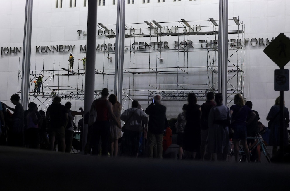 PHOTO: Lettering referencing U.S. President Donald Trump is removed from the facade of the John F. Kennedy Center for the Performing Arts, in Washington