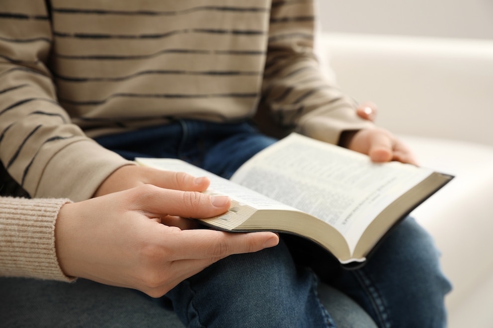 PHOTO: child with adult reading bible
