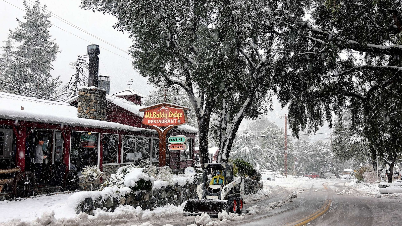 Rare snowfall in Southern California strands residents as another