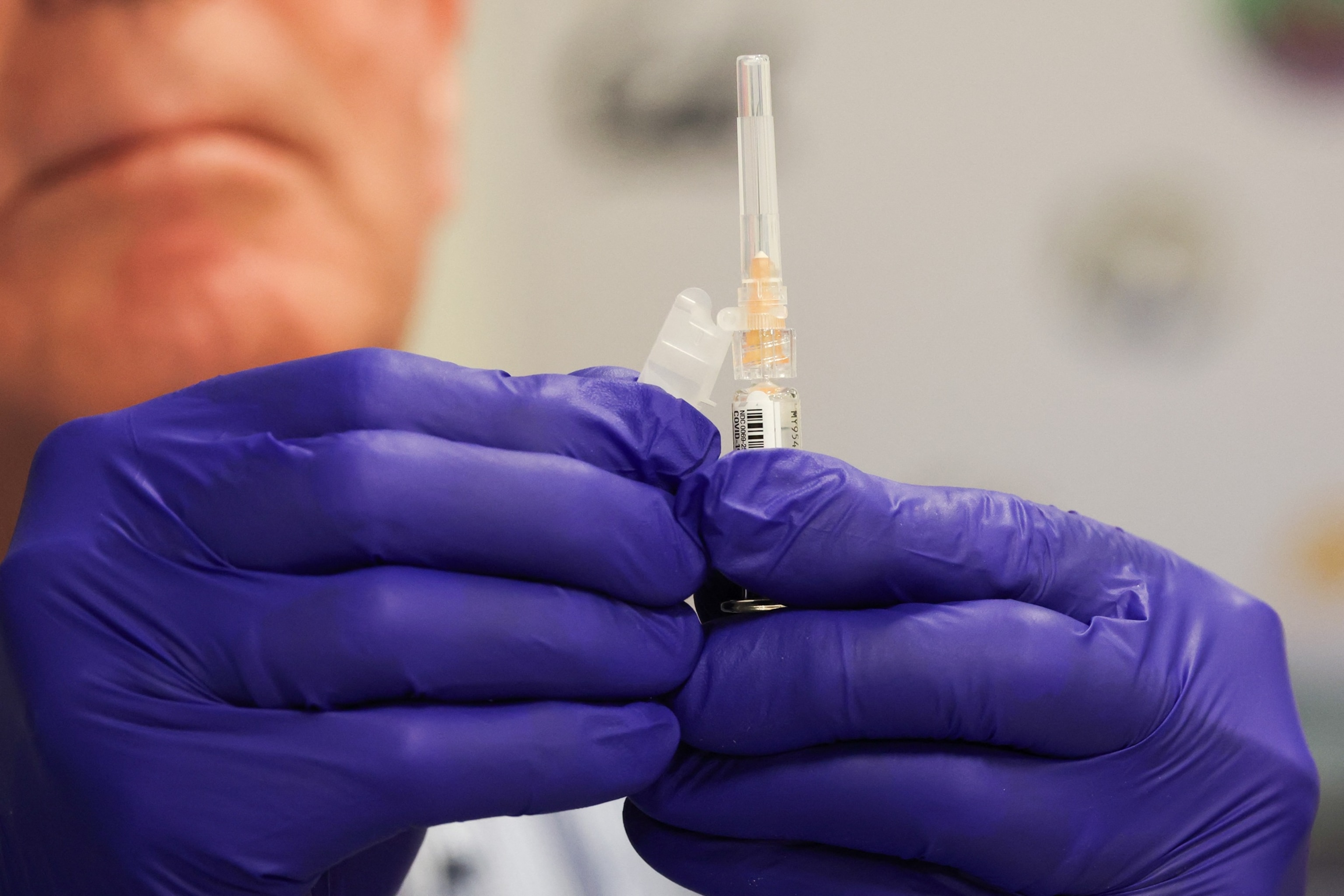 PHOTO: A pharmacist prepares a shot of the Pfizer-BioNTech COVID-19 vaccine in Los Angeles, Oct. 24, 2025.