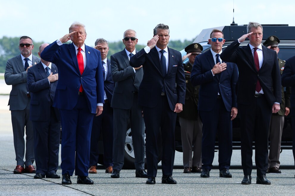 PHOTO: President Donald Trump and Secretary of War Pete Hegseth salute during a dignified transfer at Dover Air Force Base, July 22, 2026 in Dover, Delaware.