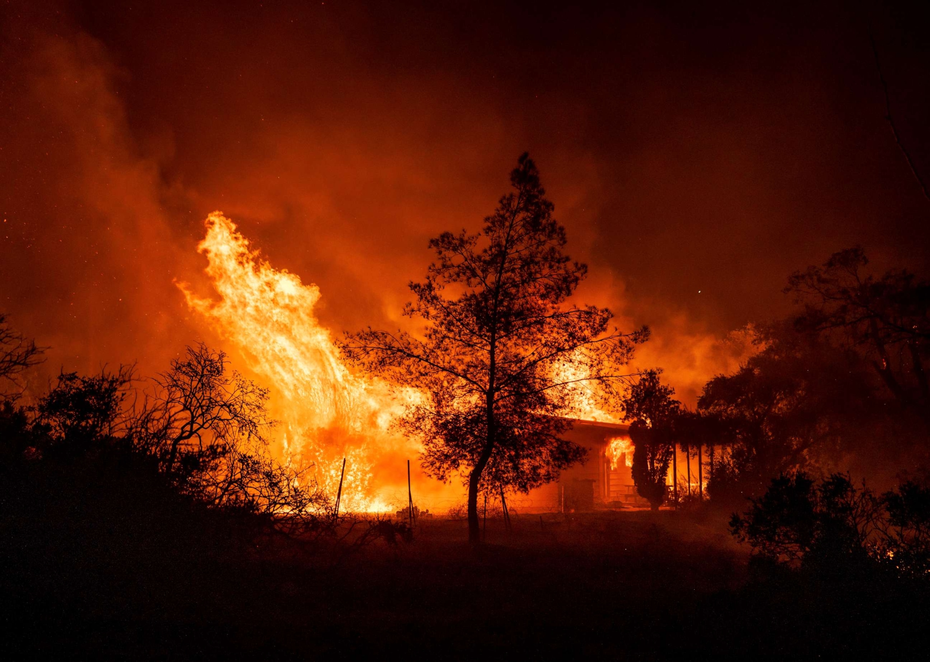 PHOTO: A structure is engulfed in flames as a wildfire called the Highland Fire burns in Aguanga, Calif., Oct. 30, 2023.