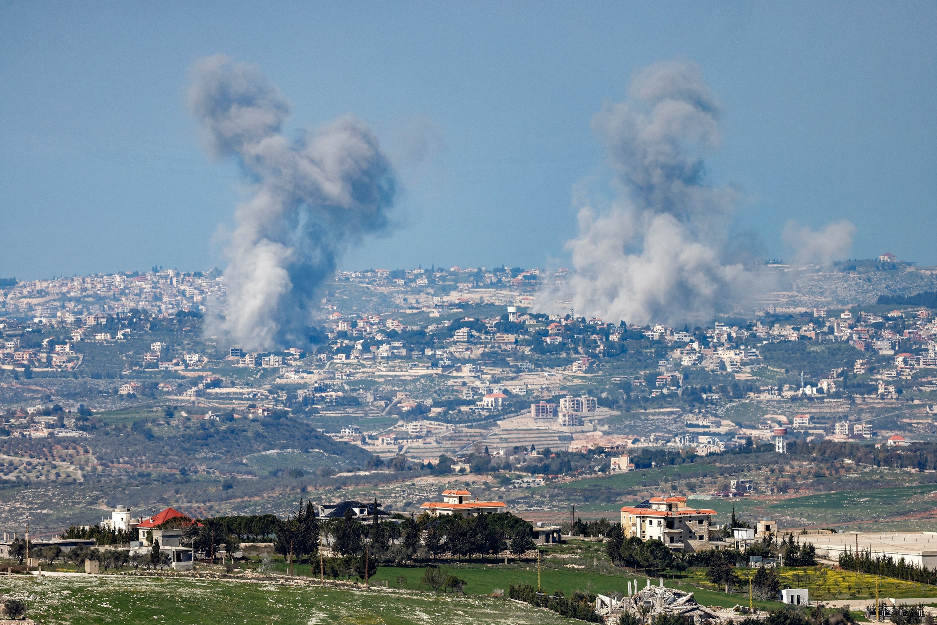 PHOTO: Smoke plumes rise following Israeli bombardment on southern Lebanon near the border with northern Israel on March 3, 2026.