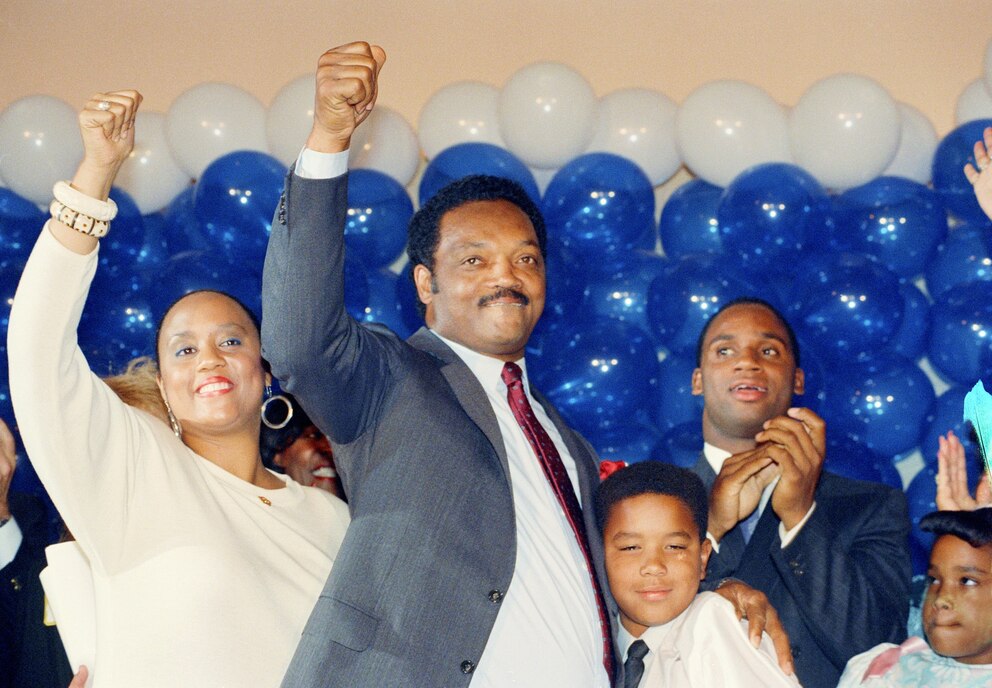 PHOTO: Jesse Jackson is joined by his daughter, Santita, and son Jonathan, far right, and unidentified youngster at the Los Angeles Hilton Hotel, June 8, 1988.