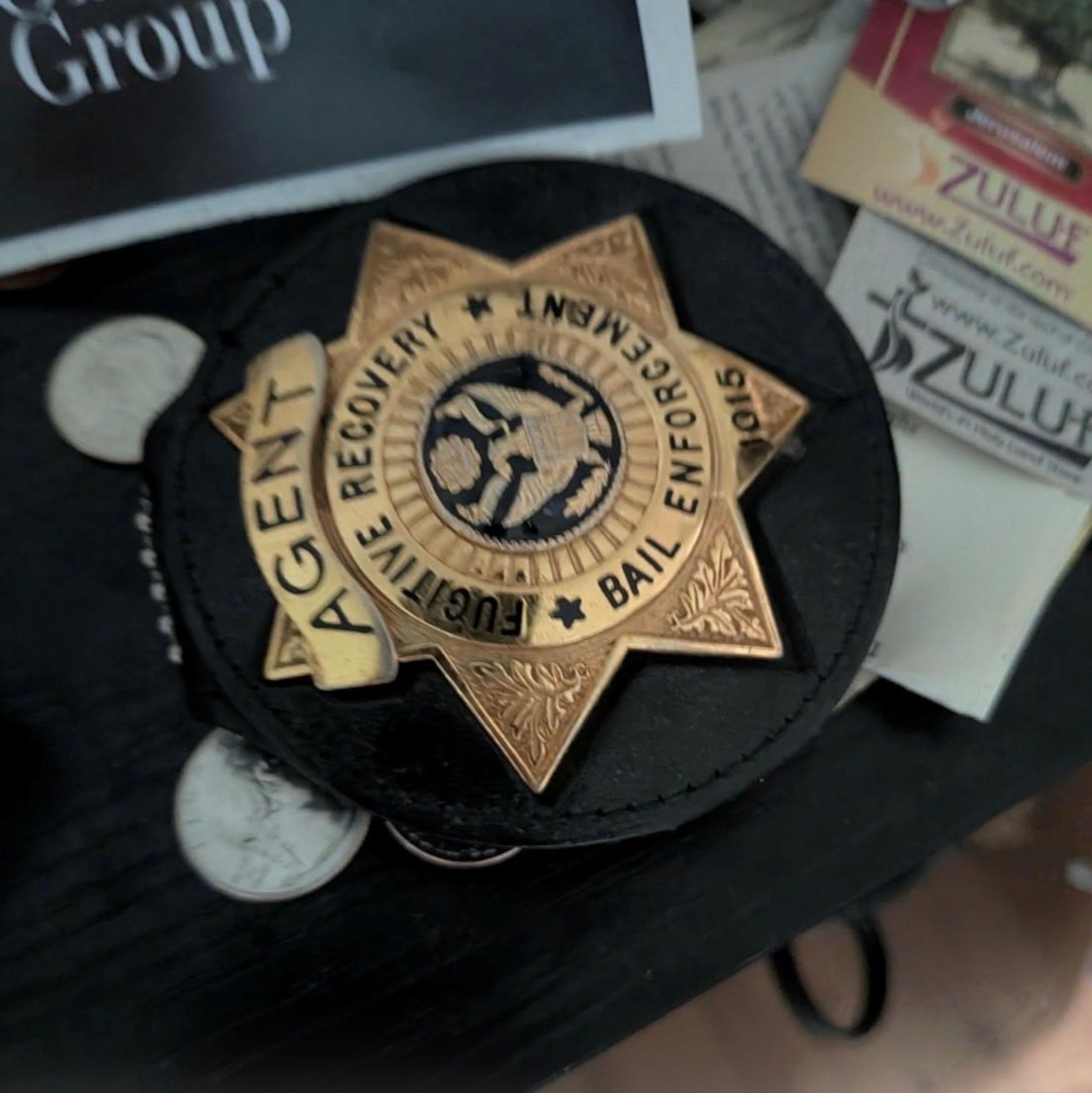 PHOTO: An image included as an exhibit in a criminal complaint filed on Tuesday, Aug. 4, 2026, against Jeanine John Taele, 38, shows what U.S. attorneys describe as a "gold-colored badge holder."