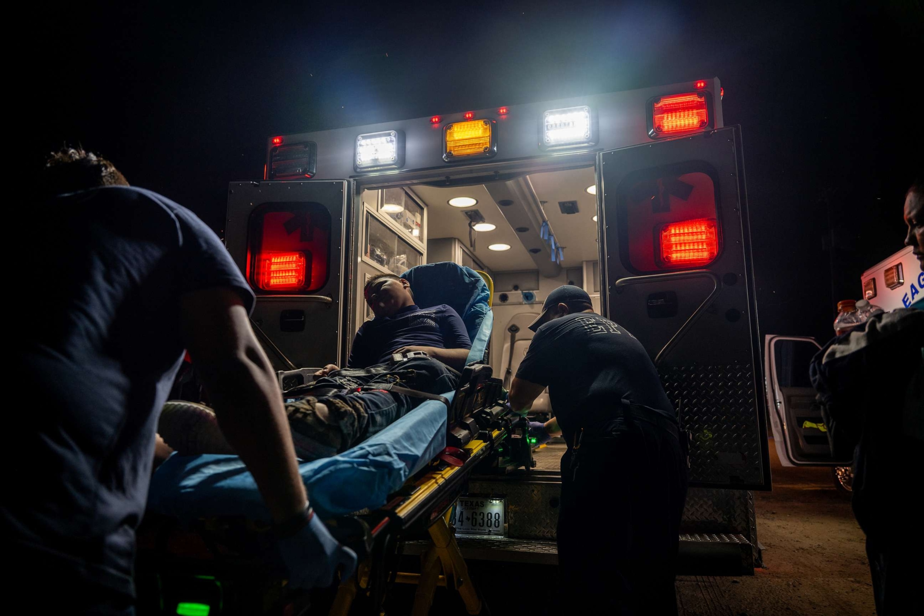 PHOTO: Darwin Varela is carried into an ambulance after suffering from dehydration on July 18, 2023 in Eagle Pass, Texas.