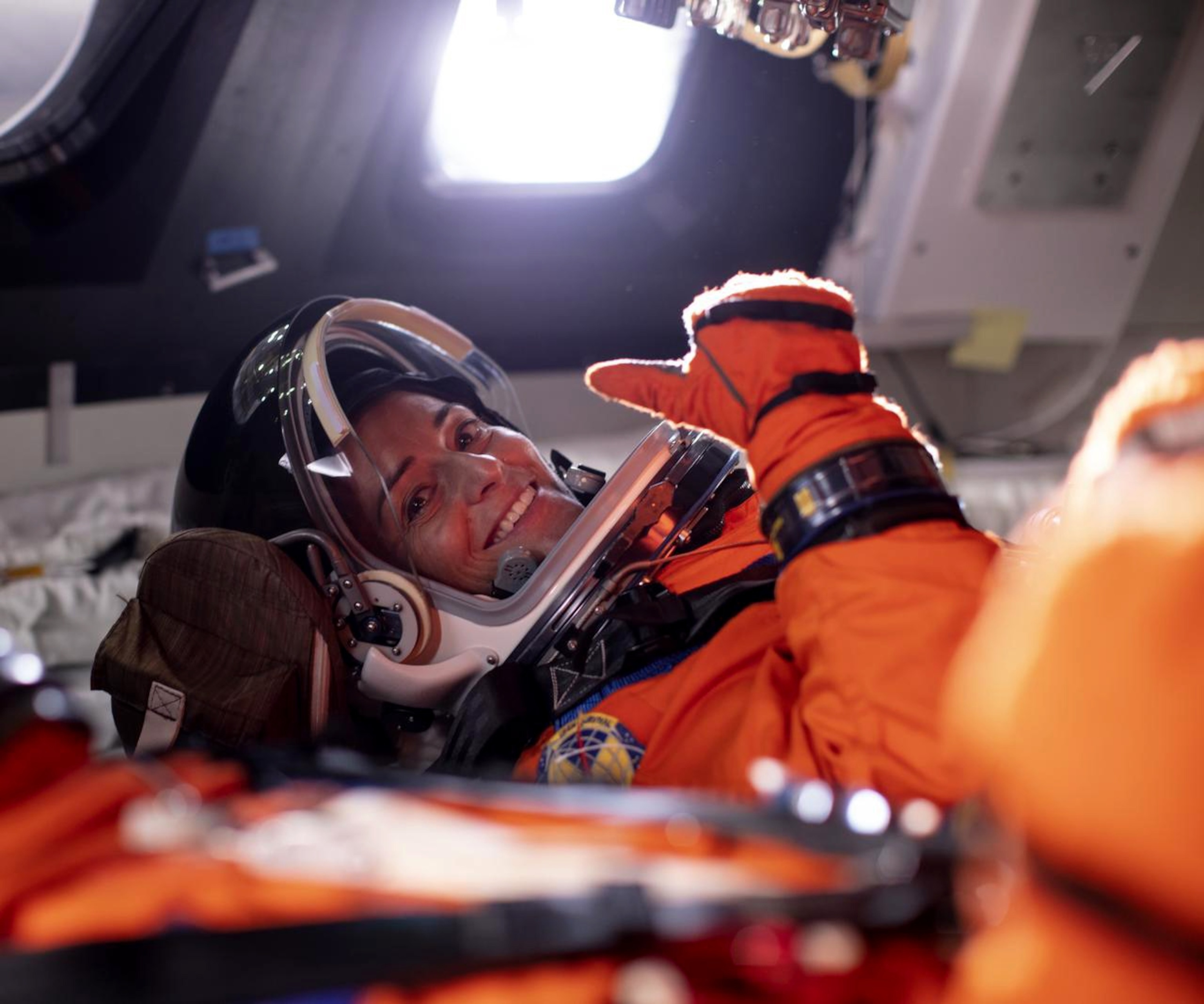 PHOTO: Nicole Mann gives a thumbs up from inside the Orion mockup at NASA's Johnson Space Center in Houston, Texas.