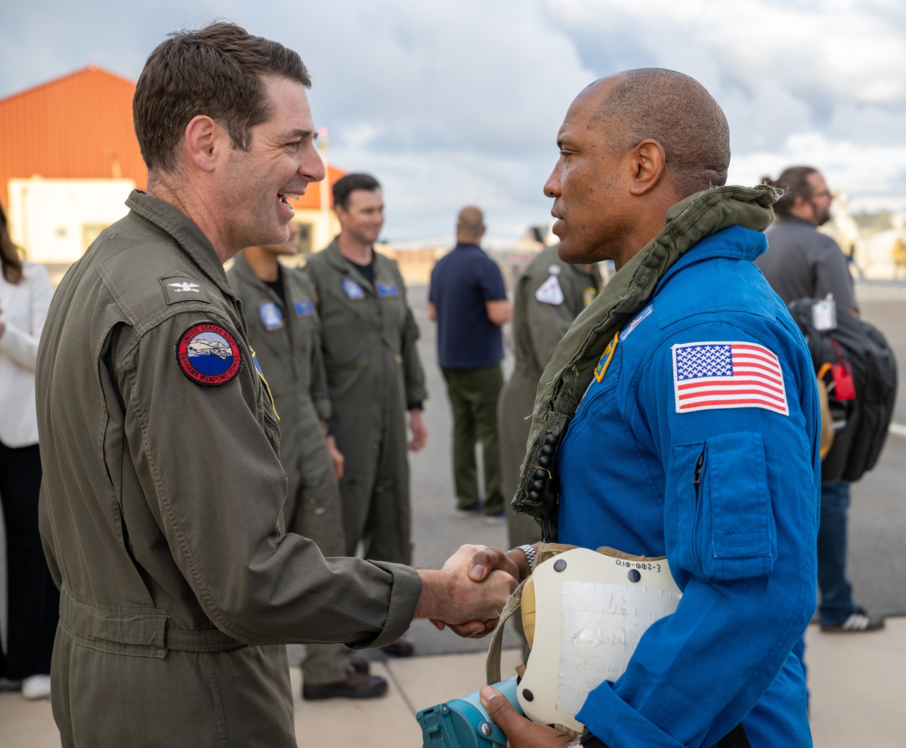 PHOTO: Artemis II NASA astronaut Victor Glover, pilot, greets Capt. Loren  Jacobi of Naval Base San Diego on April 11, 2026.