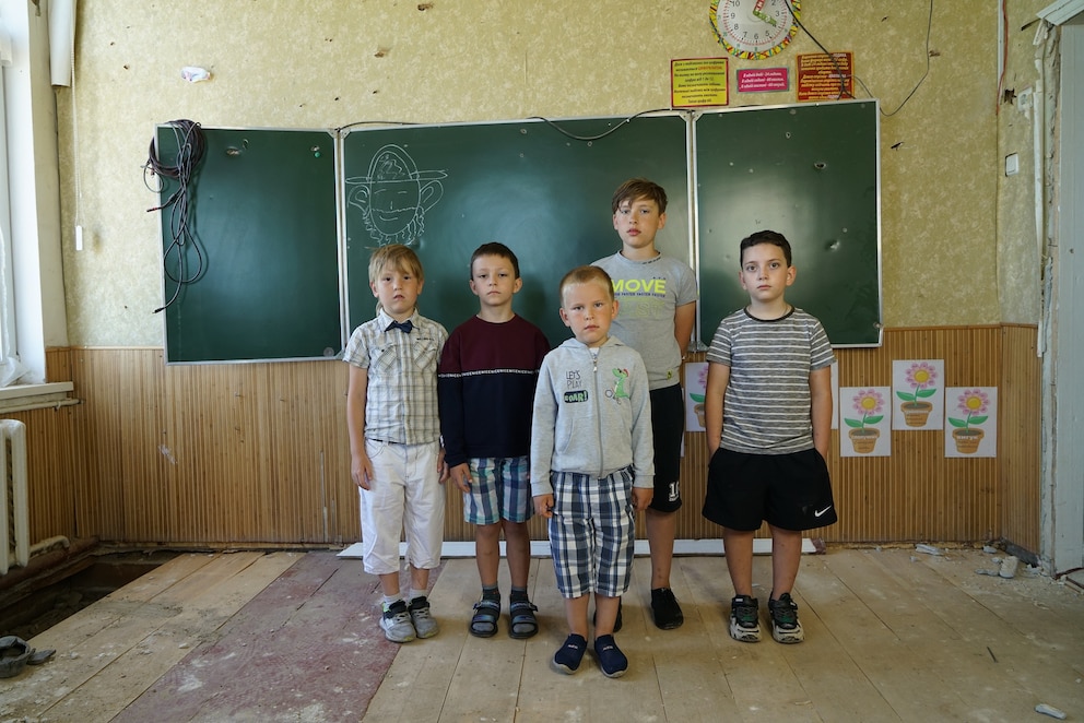 PHOTO: On July 21, 2022, 7-year-old Rostyslav, 8-year-old Kyrylo, 5-year-old Kolya, 11-year-old Andriy and 7-year-old Zakhar stand in a classroom of the elementary school in Mostysche, Ukraine.
