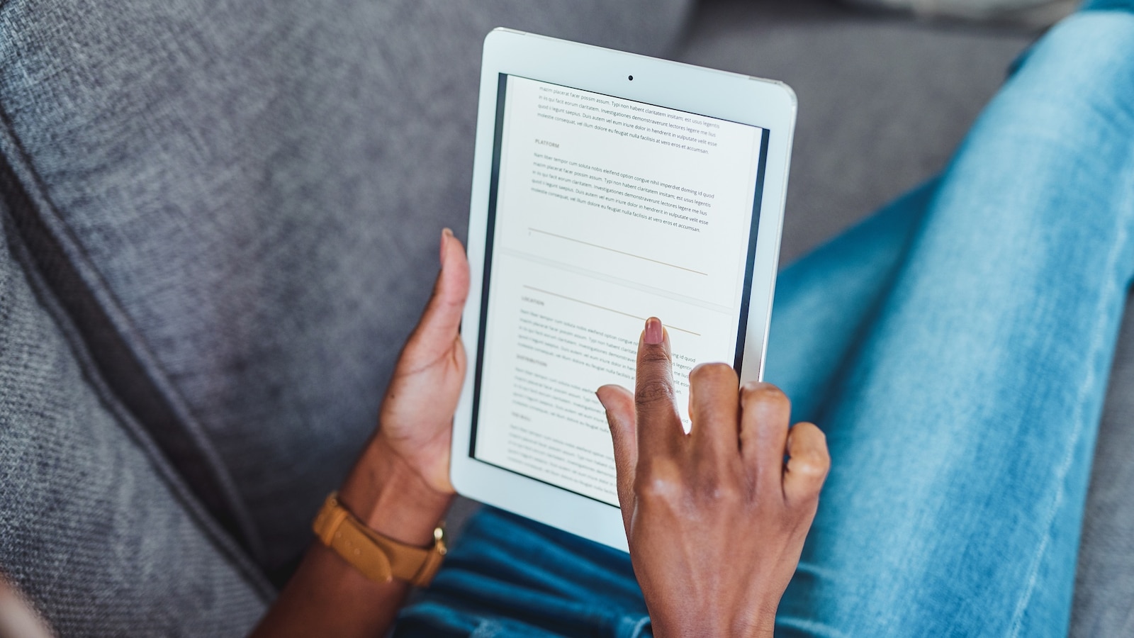 A person uses a Kindle reader.