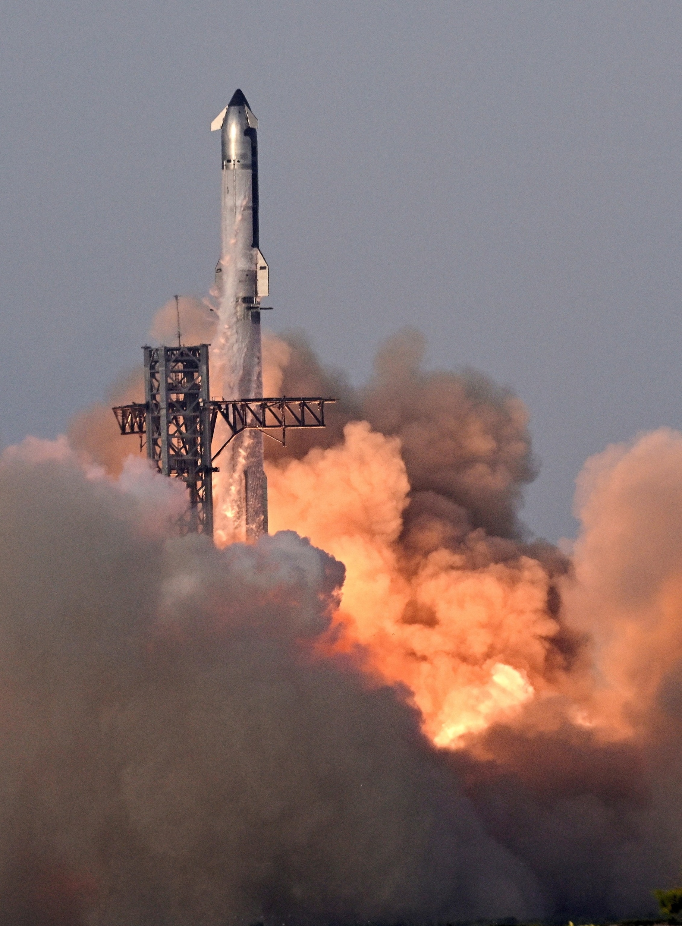 PHOTO: A SpaceX Super Heavy booster carrying the Starship spacecraft lifts off on its 10th test flight