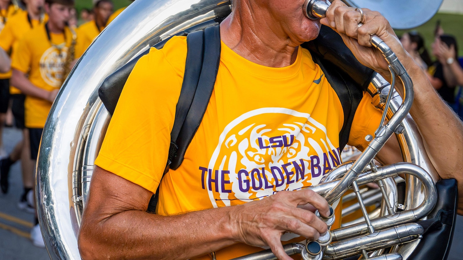 Retired accountant is hitting a high note: He's joined Louisiana State University's marching band