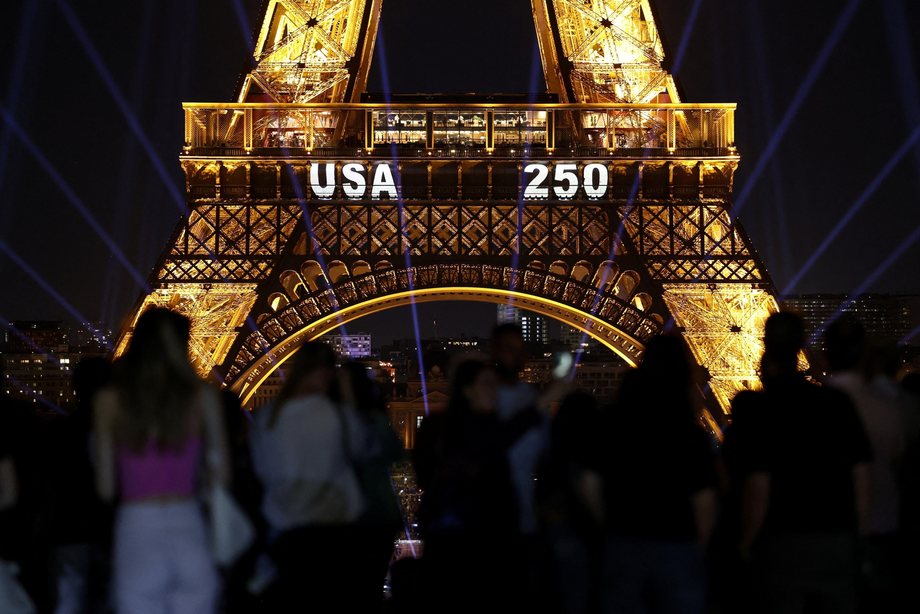 PHOTO: The Eiffel Tower lights up to mark the 250th anniversary of the United States' declaration of independence, in Paris