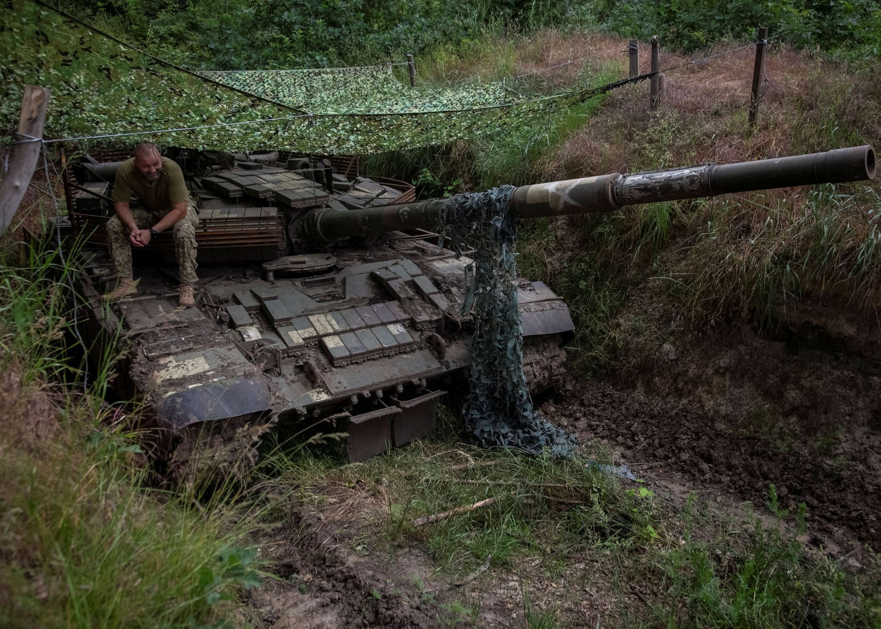 PHOTO: A Ukrainian serviceman sits atop a tank, amid Russia's attack on Ukraine, in Donetsk region, Ukraine, June 12, 2023.