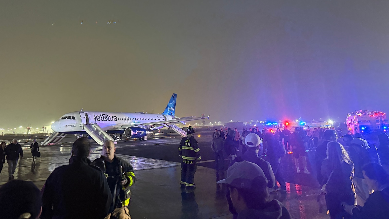 Passengers evacuated via slides in incident that temporarily suspended flights